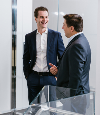 image of men standing and talking
